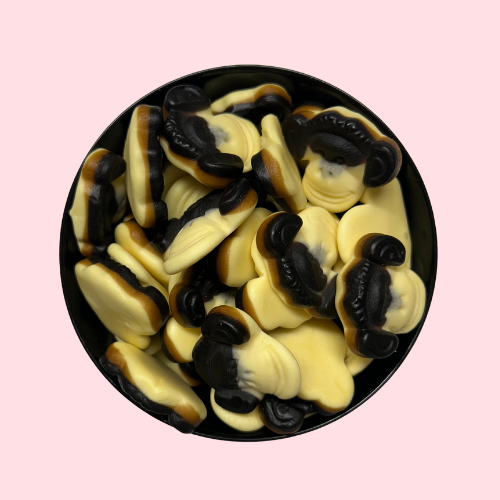Gele en zwarte Apekoppen Drop Banaan snoepjes in zwart bakje