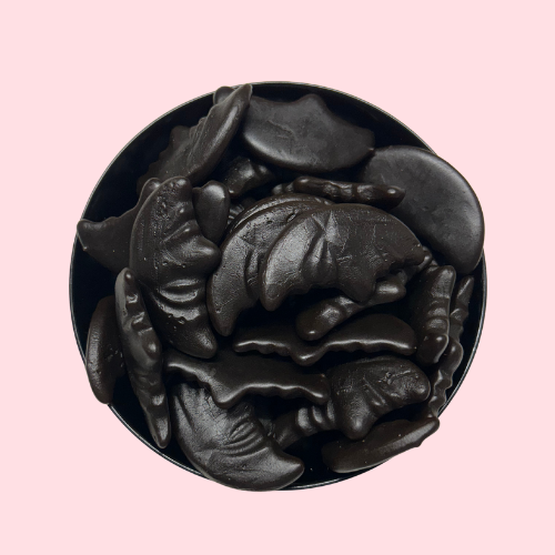 Zwarte Drop Manen snoepjes in zwart bakje