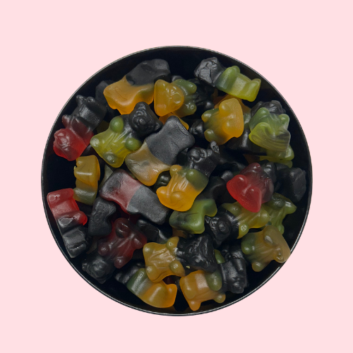 Rode, oranje, gele en zwarte Duo Bears snoepjes (drop) in zwart bakje