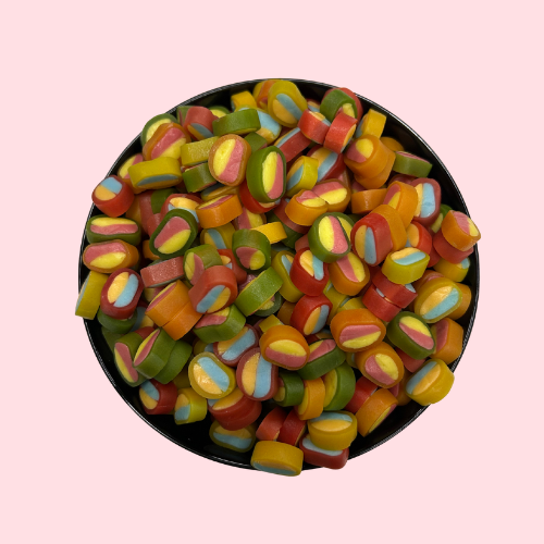 Groen-geel-roze-oranje-rode-blauwe pico Balla snoepjes in zwart bakje