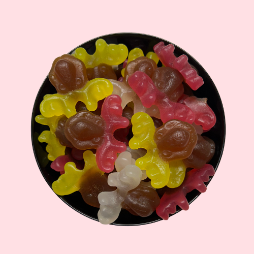 Rendieren snoepjes geel bruin rood in zwart bakje