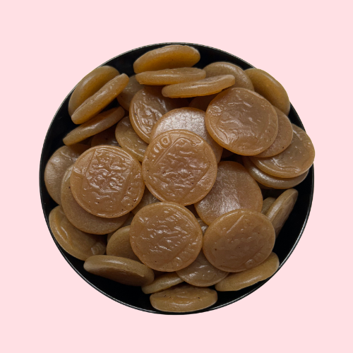 Bruine Salmiak Muntjes in zwart bakje