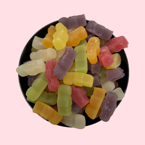 Paars-witte-groene-geel-oranje tropical babies snoep in zwart bakje