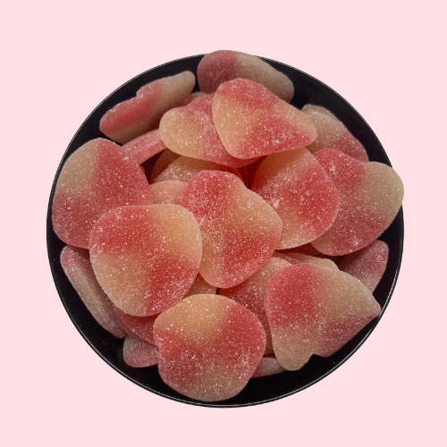 Roze en oranje White Peach Aloha snoepjes in zwart bakje