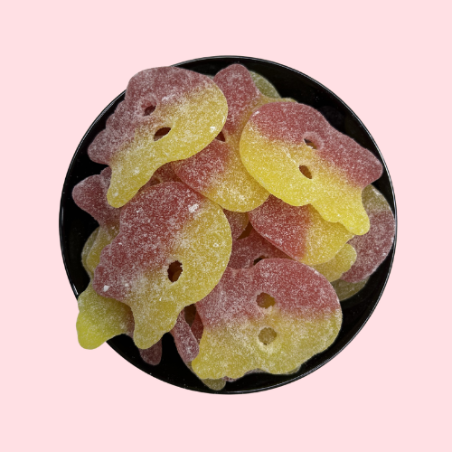Bubs Sour Raspberry Lemon Skulls rood geel skelet vorm snoep in zwart bakje
