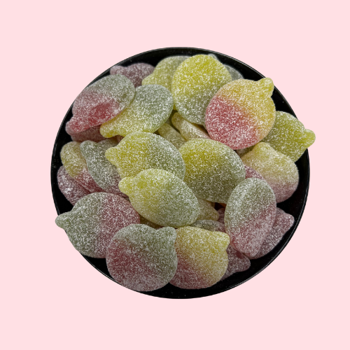 Geel-groen-rode fizzy apples snoepjes in zwart bakje