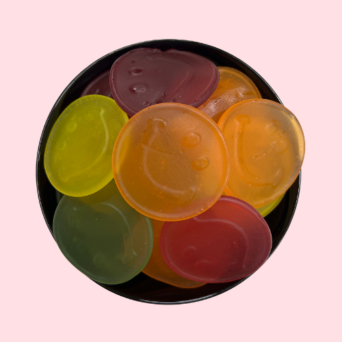 Gum smile snoep smileys groen rood oranje geel in zwart bakje