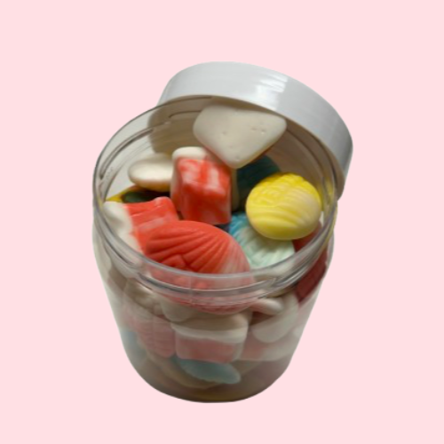 Schepsnoep pot met witte deksel en verschillende snoepjes 