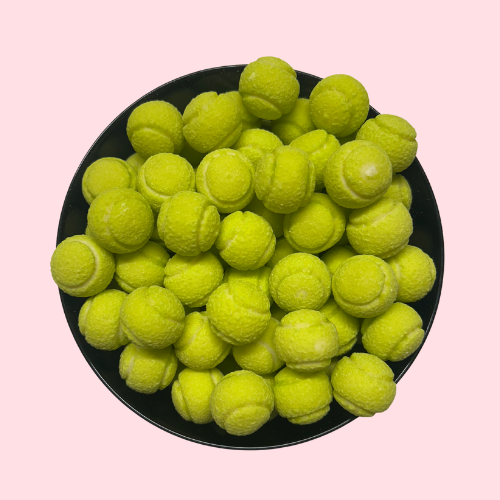 Groene Tennis Ball Gum snoepjes in zwart bakje