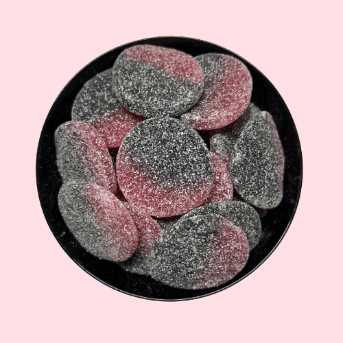 Gesuikerde zure Zure Sunsets drop en rood in zwart bakje